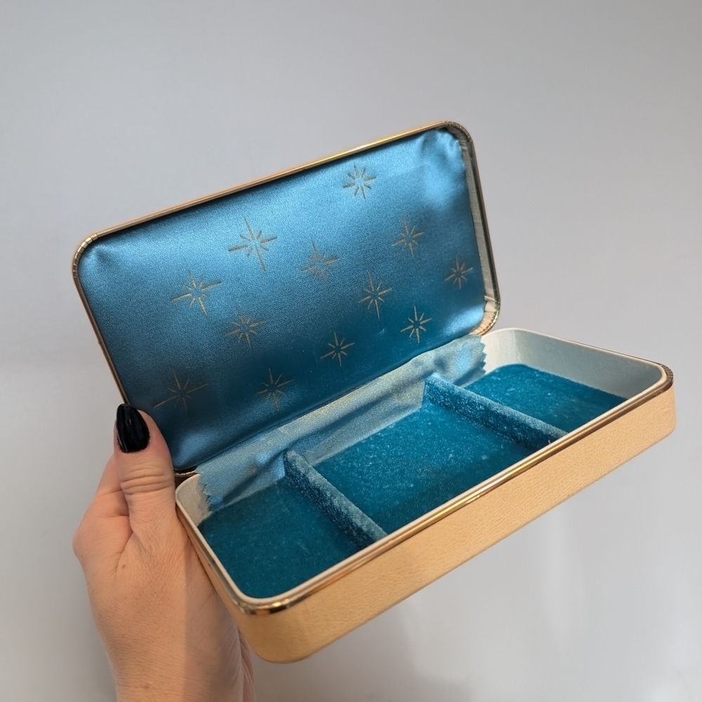 Elegant Gold and Blue Jewelry Case With Starbusts